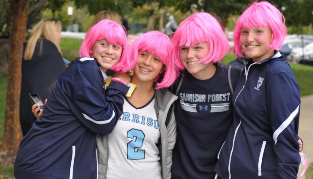 A few of the Field Hockey team members don pink wigs after the game High School Athletes in Pink Wigs