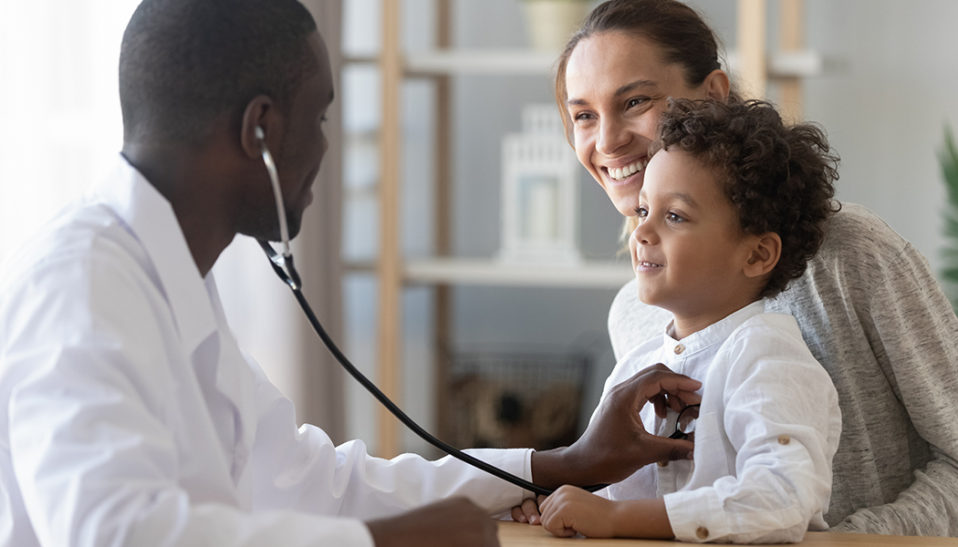 World Health Day - Pediatrician with patient and mother