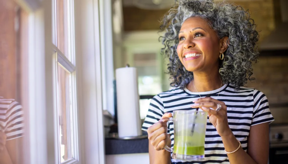 happy woman green smoothie