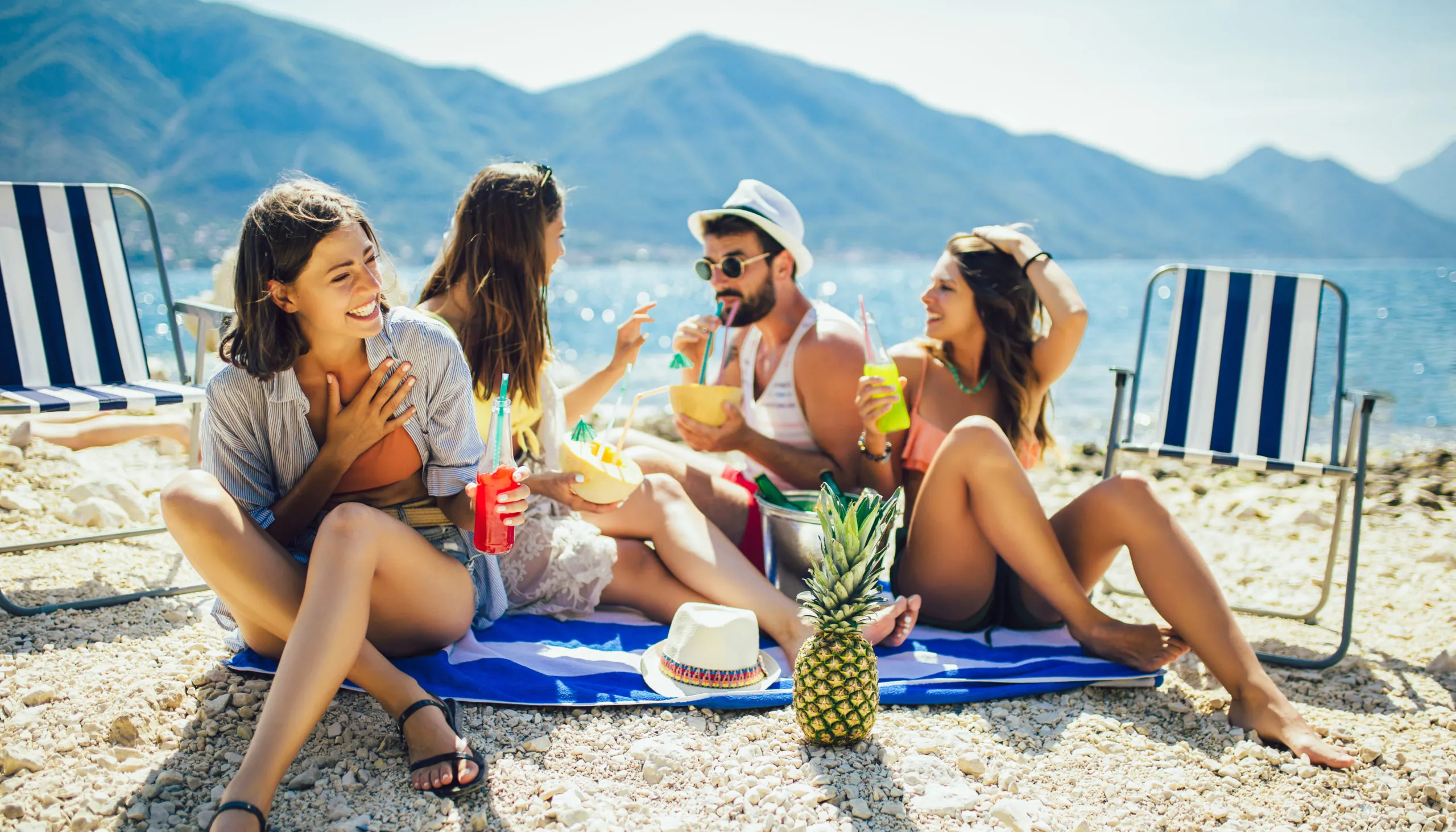 Young,Friends,Having,Fun,At,The,Beach,On,A,Sunny