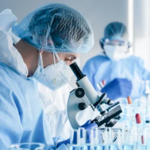 Research Programs Researcher with microscope